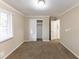 Bedroom with neutral walls, carpeting, and a large closet at 2363 Dabney Ter, Atlanta, GA 30344