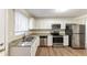 Renovated kitchen with granite countertops and stainless steel appliances at 2363 Dabney Ter, Atlanta, GA 30344