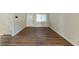 Spacious living room with dark brown wood-look flooring at 2363 Dabney Ter, Atlanta, GA 30344