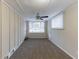 Bright living room with neutral walls, ceiling fan, and large window at 2363 Dabney Ter, Atlanta, GA 30344