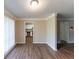 Open concept living room with hardwood floors and crown molding at 2363 Dabney Ter, Atlanta, GA 30344