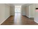 Open living room with hardwood-look floors and access to the backyard at 2363 Dabney Ter, Atlanta, GA 30344