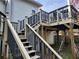 Elevated deck with stairs, railing, and backyard view at 2811 Country Farms Ct, Snellville, GA 30039