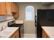 Cozy kitchen with wood cabinets, stainless steel appliances, and tiled countertops at 1403 Riverview Se Dr, Marietta, GA 30067