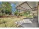 Large backyard with grassy area and covered patio at 2415 Plantation Dr, Atlanta, GA 30344
