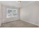 Well-lit bedroom featuring neutral walls, plush carpeting, and two windows at 2415 Plantation Dr, Atlanta, GA 30344