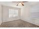 Bright bedroom with neutral walls, plush carpeting, and ample natural light at 2415 Plantation Dr, Atlanta, GA 30344