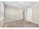 Spacious bedroom with neutral walls, plush carpeting, and multiple closets at 2415 Plantation Dr, Atlanta, GA 30344