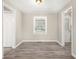 Simple dining area with wood-look floors and neutral wall colors at 2415 Plantation Dr, Atlanta, GA 30344