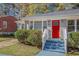 Newly renovated gray brick house with red door and curb appeal at 2415 Plantation Dr, Atlanta, GA 30344