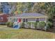 Newly renovated gray brick house with red door and curb appeal at 2415 Plantation Dr, Atlanta, GA 30344