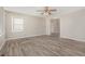 Spacious living room featuring wood-look flooring and ceiling fan at 2415 Plantation Dr, Atlanta, GA 30344