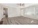 Living room with wood-look floors, neutral walls, and natural light at 2415 Plantation Dr, Atlanta, GA 30344
