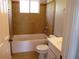 Updated bathroom with a new tub, toilet, and vanity at 6325 Westbury Rd, Riverdale, GA 30274