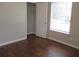 Bright bedroom featuring hardwood floors and a spacious closet at 6325 Westbury Rd, Riverdale, GA 30274