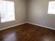 Spacious bedroom with hardwood floors and neutral walls at 6325 Westbury Rd, Riverdale, GA 30274