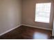 Dark hardwood floors and neutral-colored walls at 6325 Westbury Rd, Riverdale, GA 30274