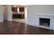 Open concept living room with hardwood floors and a view into the kitchen at 6325 Westbury Rd, Riverdale, GA 30274