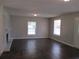 Living room boasts dark hardwood floors, fireplace, and an open floor plan at 6325 Westbury Rd, Riverdale, GA 30274