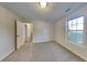 Bedroom with window and access to bathroom at 250 Fieldstone Ln, Covington, GA 30016