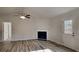 Living room featuring a fireplace and access to back deck at 250 Fieldstone Ln, Covington, GA 30016