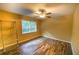 Bright bedroom featuring wood-look floors and large window at 6940 Roswell Rd # C14, Atlanta, GA 30328