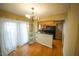 Dining area with hardwood floors and kitchen access at 6940 Roswell Rd # C14, Atlanta, GA 30328