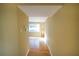 Hallway with hardwood floors and access to living room at 6940 Roswell Rd # C14, Atlanta, GA 30328
