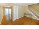 Bright living room with hardwood floors and view of dining area at 6940 Roswell Rd # C14, Atlanta, GA 30328