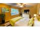 Spacious bedroom with large bed, dresser, and window at 6940 Roswell Rd # C14, Atlanta, GA 30328