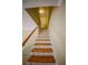 Elegant staircase with hardwood treads and white railing at 6940 Roswell Rd # C14, Atlanta, GA 30328