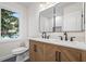 Modern bathroom with double vanity, large mirrors, and stylish cabinetry at 1697 Dyson Ne Dr, Atlanta, GA 30307