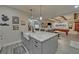 Basement kitchen island with white farmhouse sink and granite countertop at 5035 Shade Creek Xing, Cumming, GA 30028