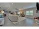 Spacious basement living area with gray flooring, sectional sofa, and fireplace at 5035 Shade Creek Xing, Cumming, GA 30028