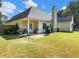 Spacious backyard with patio, grill, and fenced yard at 522 Red Tip Ln, Loganville, GA 30052