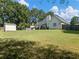 Backyard with shed and grassy area at 522 Red Tip Ln, Loganville, GA 30052