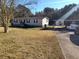 Mobile home with a yard, driveway, and carport at 230 Highland Blvd, Stockbridge, GA 30281