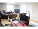 Finished basement with a large TV, seating area, and home office at 6298 Hampstead Ln, Douglasville, GA 30134