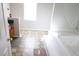 Main bathroom with a jacuzzi tub and neutral-toned tile flooring at 6298 Hampstead Ln, Douglasville, GA 30134