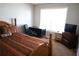 Bedroom with large window, a double bed, and a built-in desk at 6298 Hampstead Ln, Douglasville, GA 30134