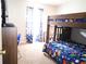 bedroom with bunk bed, a desk, and dinosaur-themed bedding at 6298 Hampstead Ln, Douglasville, GA 30134
