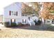 Two-story house with gray siding, white stairs, and landscaping at 6298 Hampstead Ln, Douglasville, GA 30134
