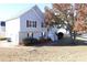 Two-story house with gray siding, white stairs, and landscaping at 6298 Hampstead Ln, Douglasville, GA 30134