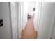 Bright hallway with light walls and wood flooring leading to living area at 6298 Hampstead Ln, Douglasville, GA 30134