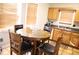 Bright kitchen with wood cabinets, stainless steel appliances, and a breakfast nook at 6298 Hampstead Ln, Douglasville, GA 30134