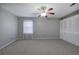 Bright bedroom featuring a ceiling fan and ample closet space at 911 S Lassetter Cir, Villa Rica, GA 30180