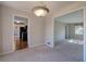 Dining room with chandelier and views to kitchen and living room at 911 S Lassetter Cir, Villa Rica, GA 30180