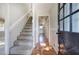 Bright entryway with hardwood floors and staircase at 911 S Lassetter Cir, Villa Rica, GA 30180