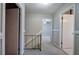 Upstairs hallway with carpet and access to bedrooms at 911 S Lassetter Cir, Villa Rica, GA 30180