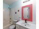 Clean bathroom with shower/tub combo and coral mirror at 70 Camden Woods Pl, Dallas, GA 30157